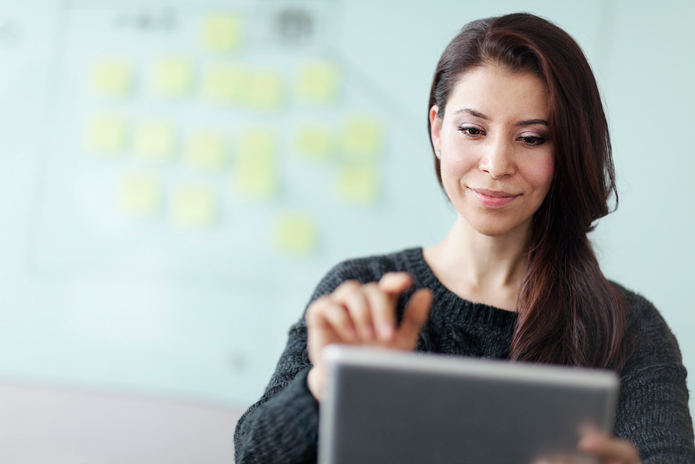 Woman working on tablet computer